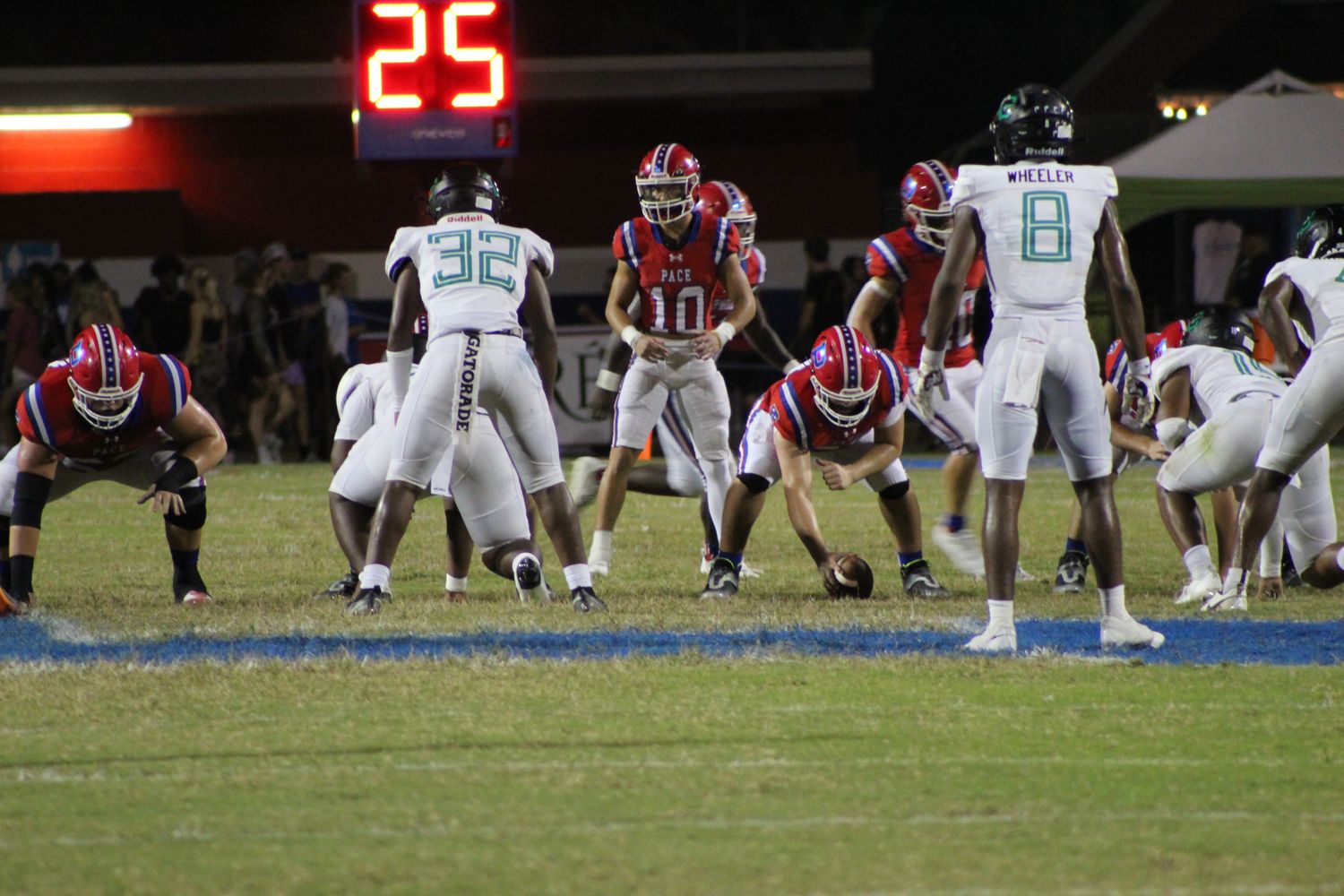 Pace quarterback Nick Simmons (10) studies the Choctawhatchee defense, pre-snap, during his team's 41-17 win in its 2023 season-opener.